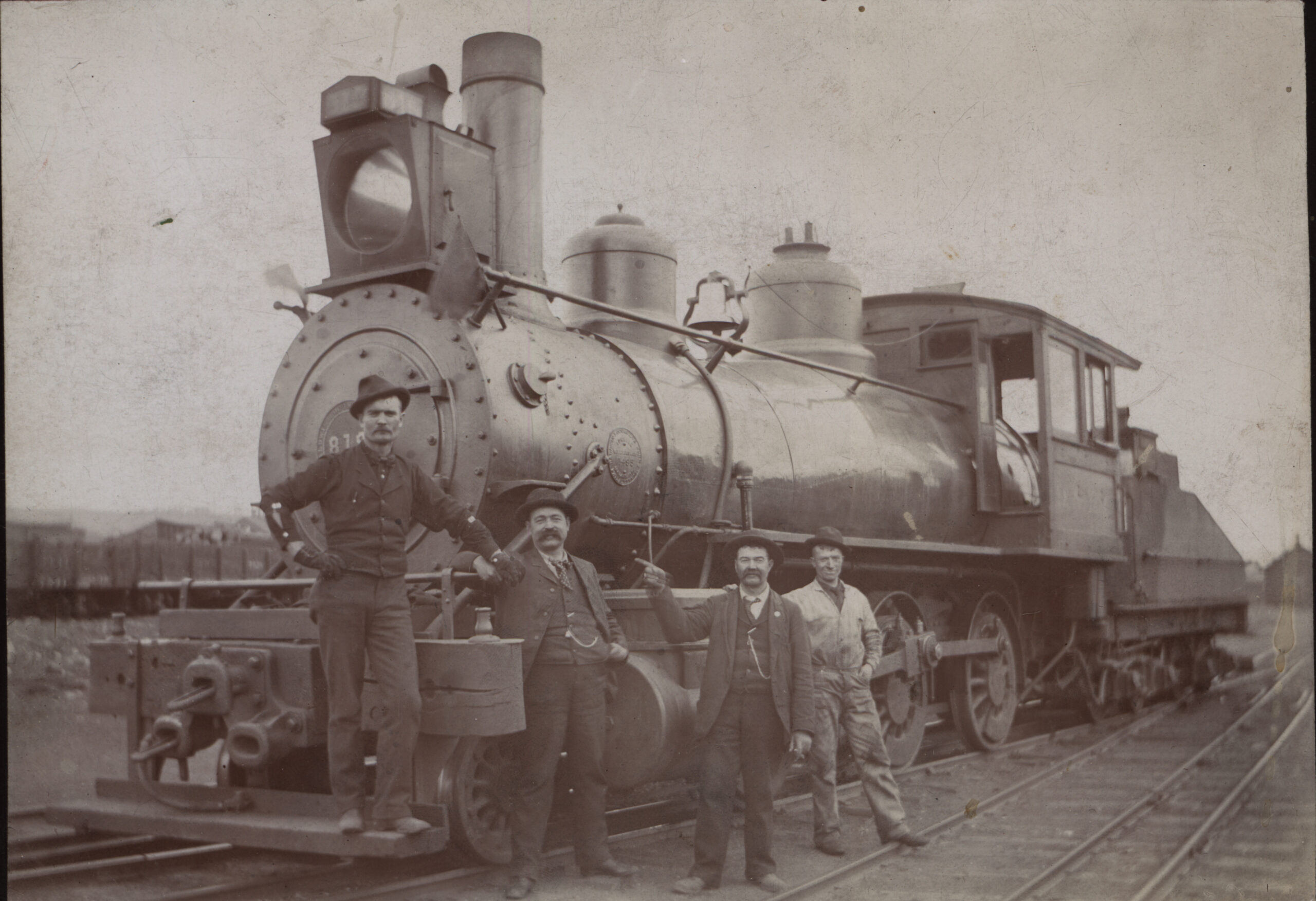 Four Denver and Rio Grande Railroad Workers standing by Engine 819 part of the Unknown Collection Salida Regional Library